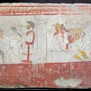 Juegos de gladiadores (a la derecha un combate armado, y a la izquierda un combate de boxeo entre un blanco y un negro al son del aulós) en honor de un difunto. Fresco de tumba lucana en el Museo Arqueológico Nacional de Paestum.